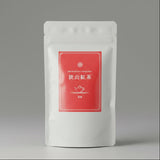 A package of Yokota Tea Garden's Premium Tea Collection, featuring red and white text on a white background.