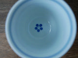 Saikai Ceramics: Red Trim, White Porcelain Yunomi Tea Cup with Blue Accents 150 ml - Yunomi.life